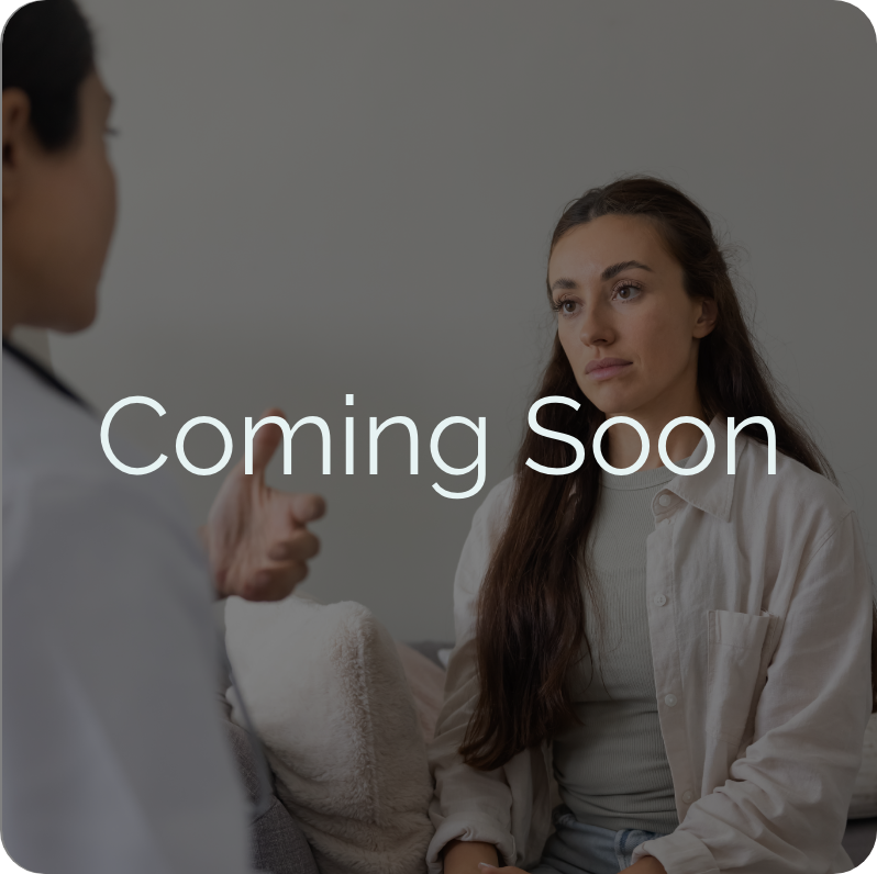 Coming Soon overlay on doctor counseling young woman